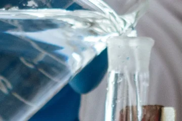 Ethanol being poured in a lab